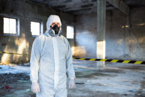 Image of an emergency situations specialist standing inside a building that has high radiation exposure.